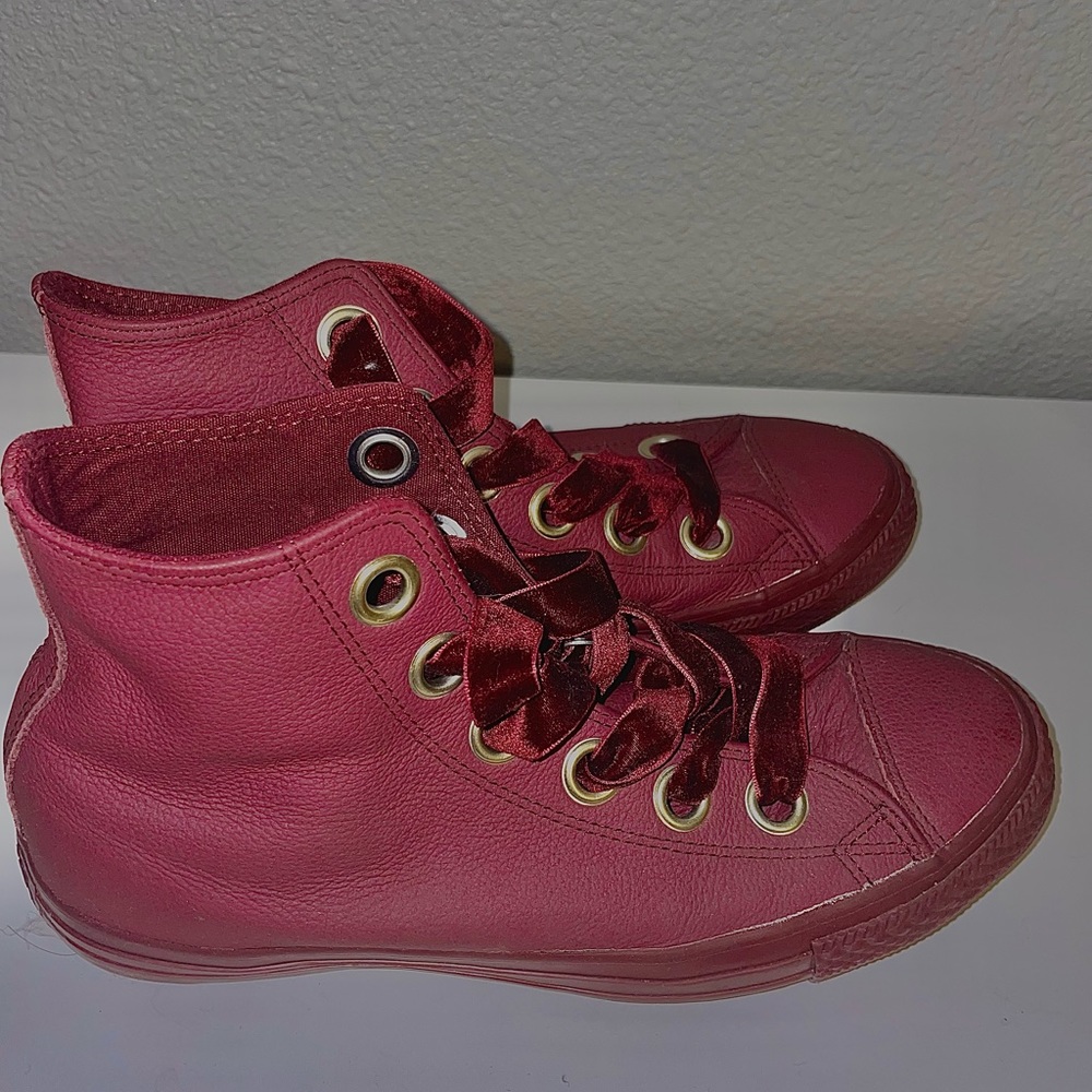 Adorable burgundy leather high top converse with velvet laces, and gold logo.